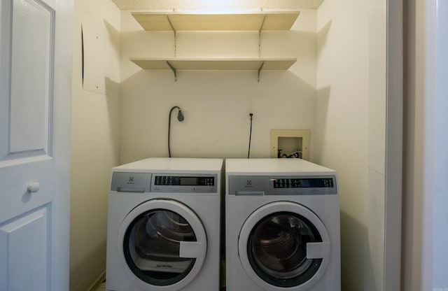 clothes washing area featuring washing machine and dryer