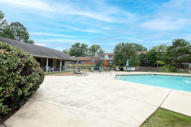 view of swimming pool featuring a patio area