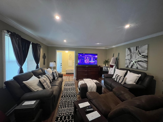 living room with hardwood / wood-style flooring and crown molding