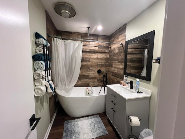 bathroom featuring shower / bath combo, wood-type flooring, and vanity