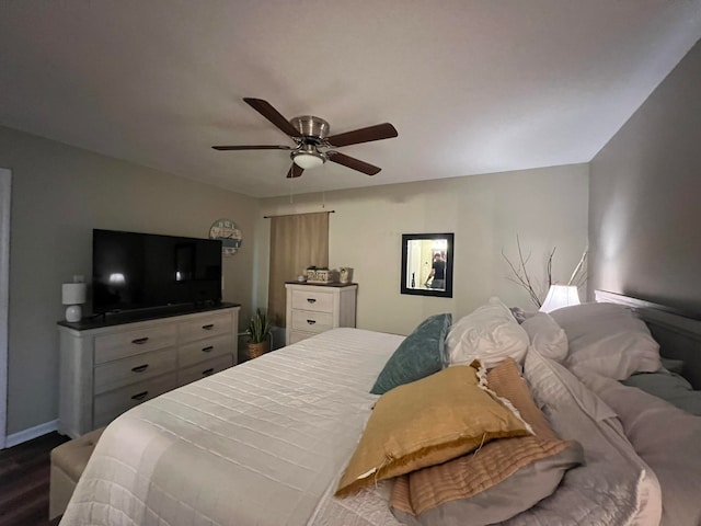 bedroom with ceiling fan and wood-type flooring