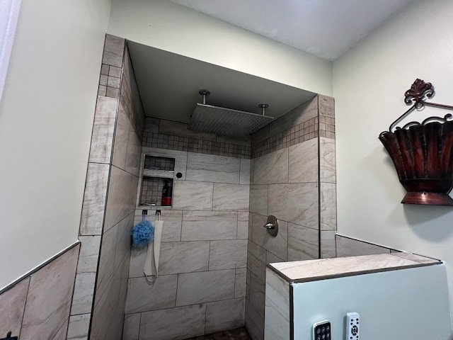 bathroom with tiled shower