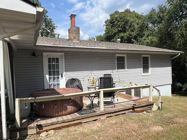 wooden deck featuring a yard