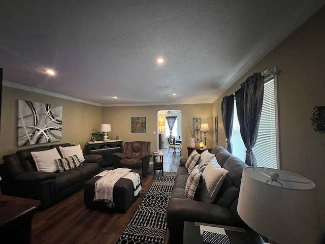 living room featuring a textured ceiling, crown molding, and hardwood / wood-style flooring