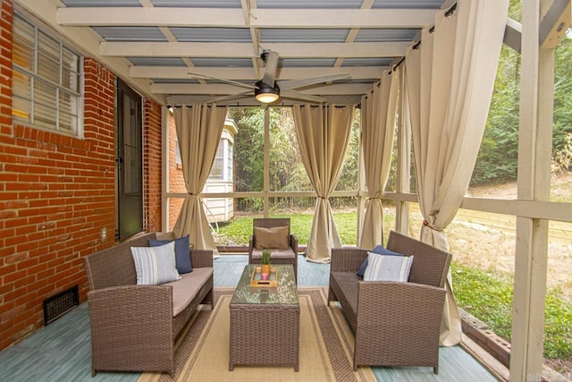 exterior space with a wealth of natural light and ceiling fan