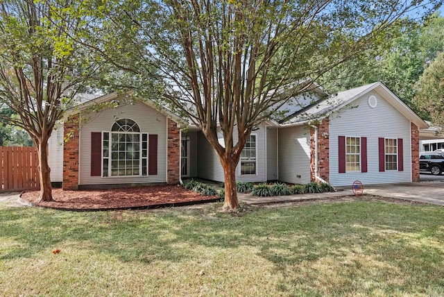 ranch-style home with a front lawn