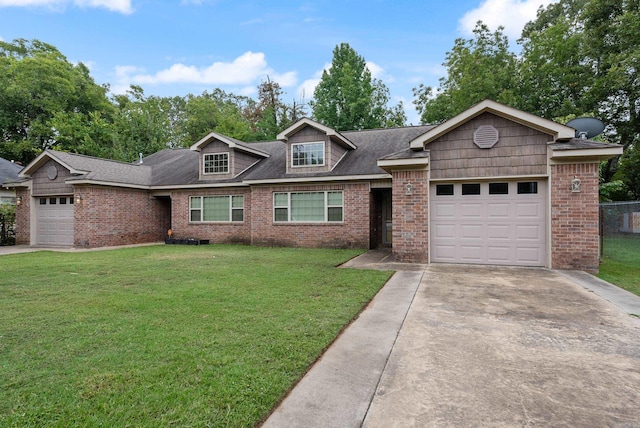 view of front of house featuring a front yard and a garage