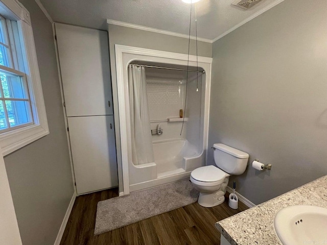 full bathroom featuring shower / bath combination with curtain, toilet, hardwood / wood-style flooring, and vanity