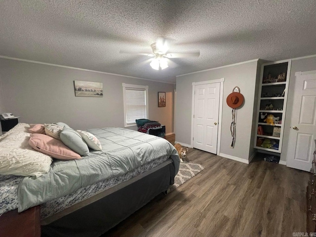 bedroom with crown molding, dark wood-type flooring, a textured ceiling, and ceiling fan