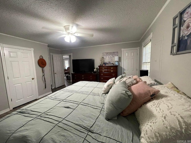 bedroom featuring ornamental molding, a textured ceiling, and ceiling fan