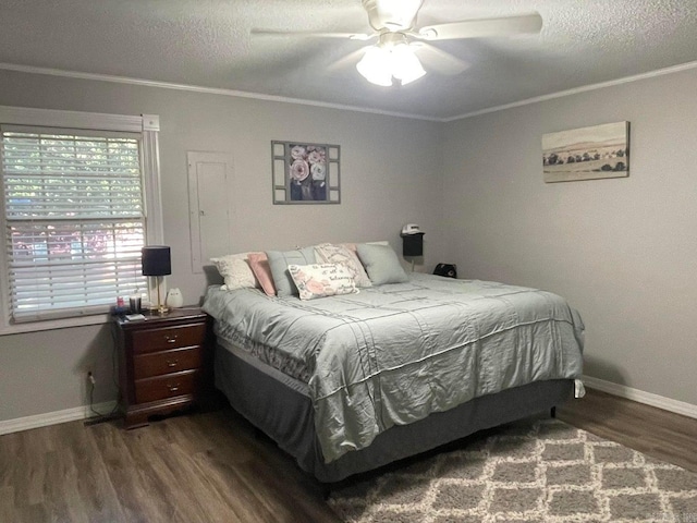 bedroom with ceiling fan, crown molding, wood-type flooring, and a textured ceiling