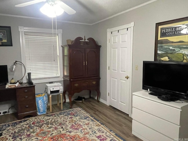 office area with crown molding, dark wood-type flooring, ceiling fan, and a textured ceiling