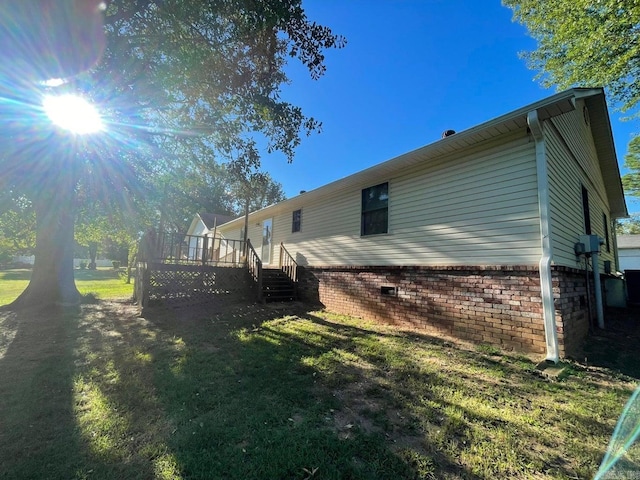 view of home's exterior featuring a yard