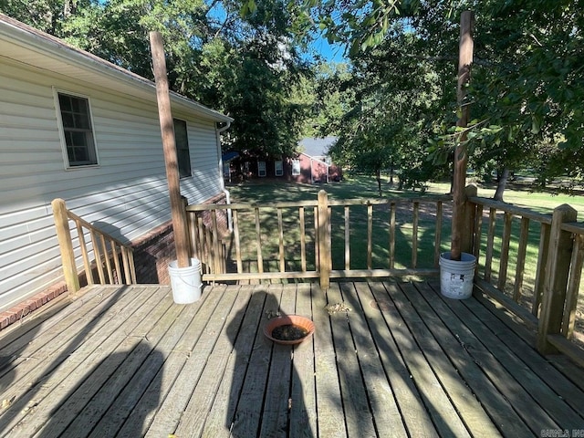 wooden terrace with a yard