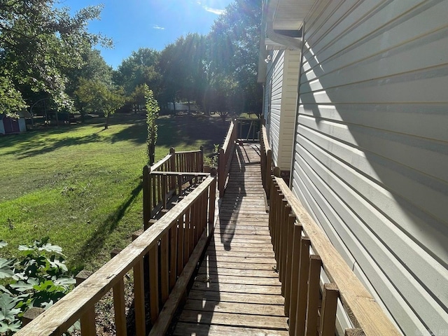 wooden deck featuring a yard