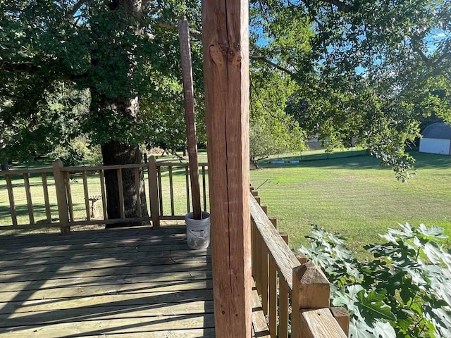 wooden deck with a lawn