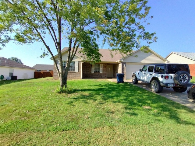 single story home with a garage and a front yard