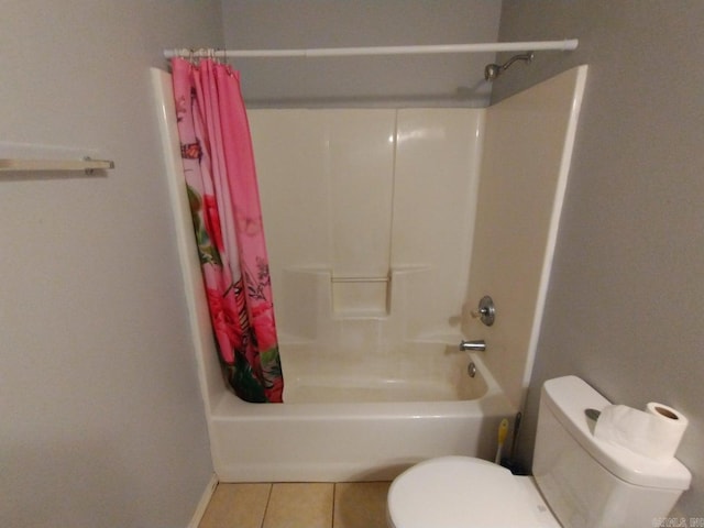 bathroom featuring toilet, shower / tub combo with curtain, and tile patterned floors