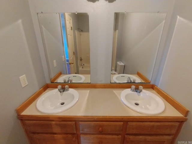 full bathroom featuring toilet, bathing tub / shower combination, and vanity