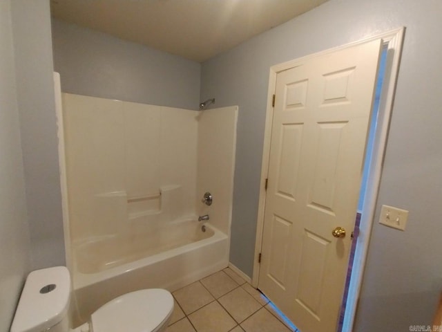 bathroom featuring tile patterned flooring, toilet, and shower / bathtub combination