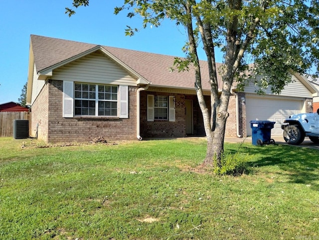 ranch-style house featuring central air condition unit, a garage, and a front yard