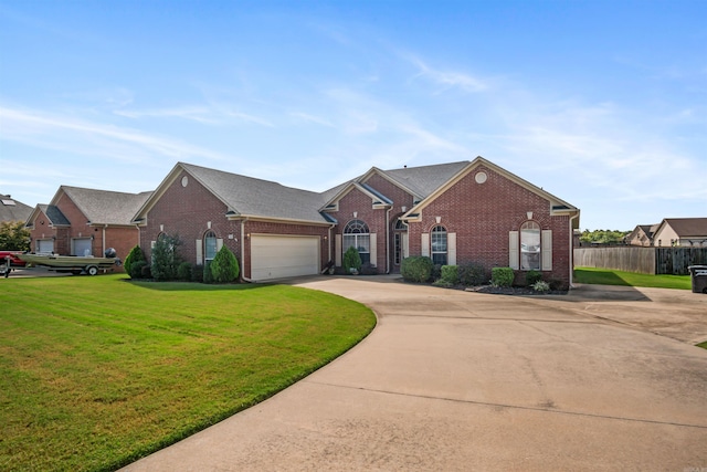 view of front of property with a garage and a front lawn