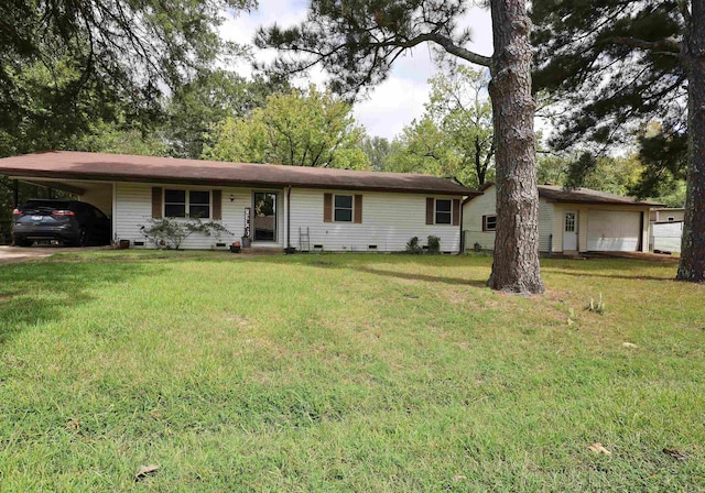 ranch-style house with a garage, a carport, and a front lawn