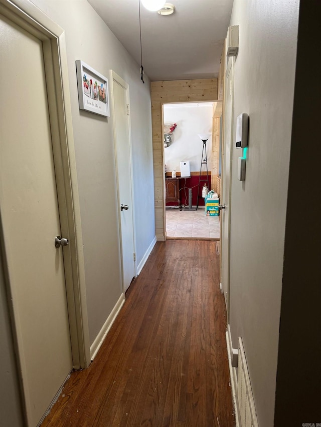 hallway featuring dark hardwood / wood-style flooring