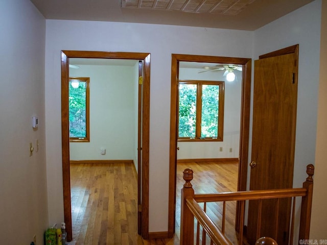 hall with hardwood / wood-style floors