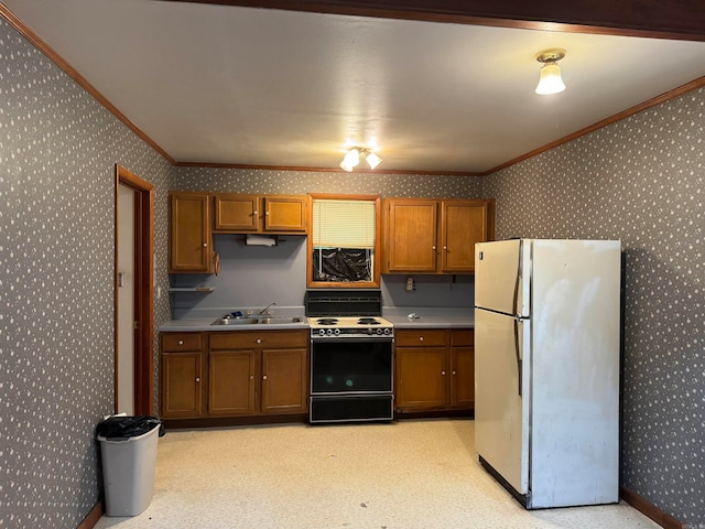 kitchen with ornamental molding, white refrigerator, stove, and sink