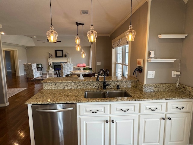 kitchen with dark hardwood / wood-style flooring, ceiling fan, sink, and white cabinetry