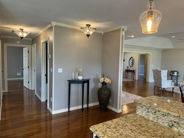 interior space with dark hardwood / wood-style flooring and crown molding