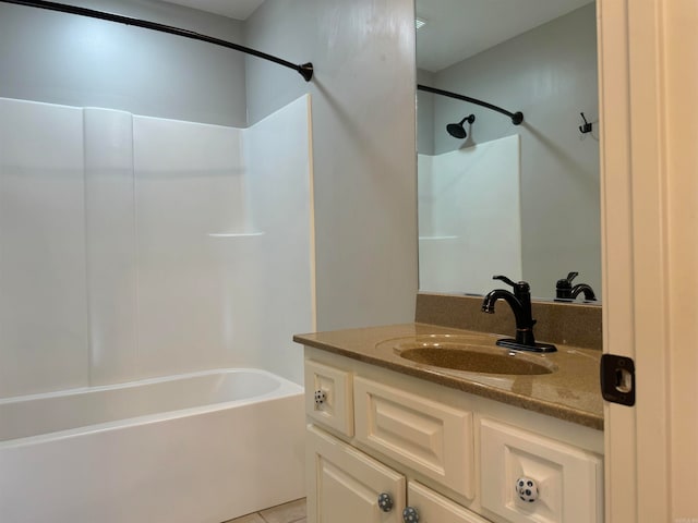 bathroom featuring shower / bathing tub combination, vanity, and tile patterned floors