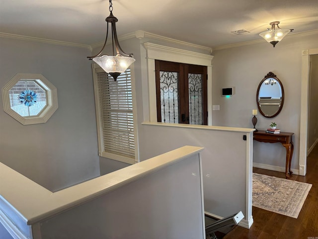 hallway with dark hardwood / wood-style floors and crown molding