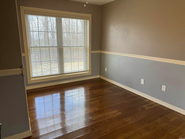 empty room featuring dark wood-type flooring