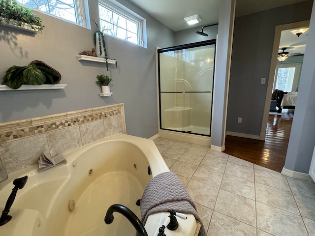 bathroom featuring separate shower and tub, wood-type flooring, and ceiling fan