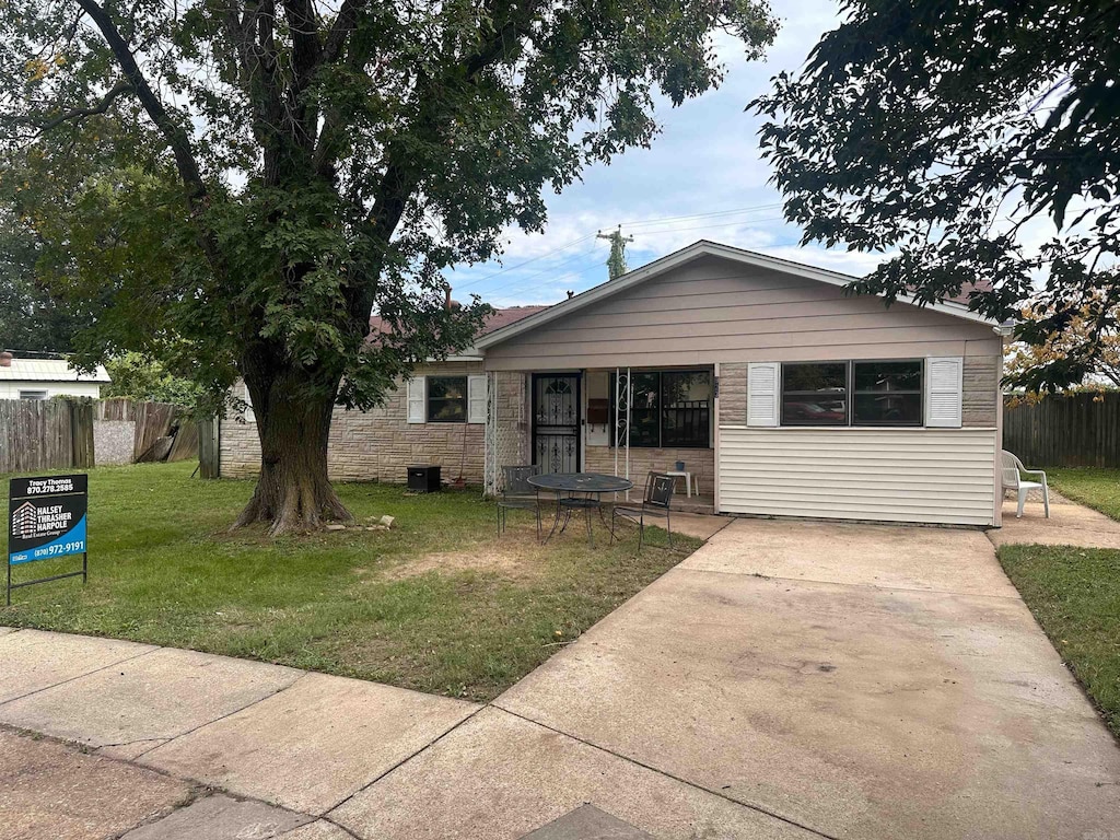 bungalow-style house with a front yard