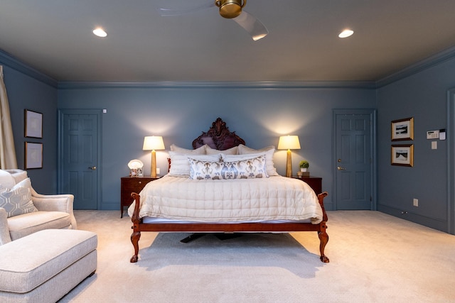 carpeted bedroom featuring ceiling fan and ornamental molding