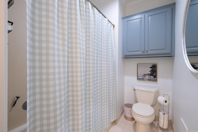 bathroom featuring toilet, walk in shower, and tile patterned flooring