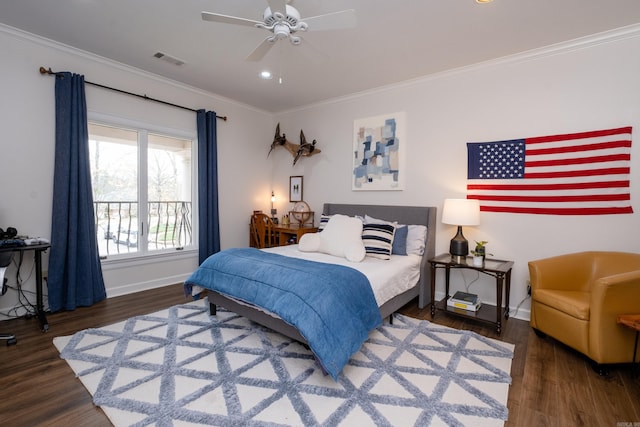 bedroom with ceiling fan, dark hardwood / wood-style floors, and ornamental molding