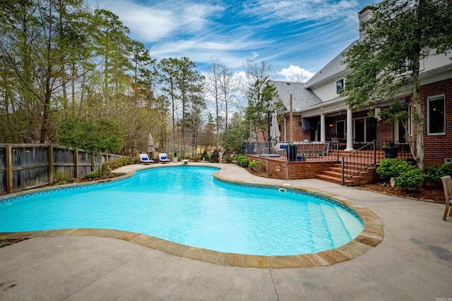 view of pool featuring a patio