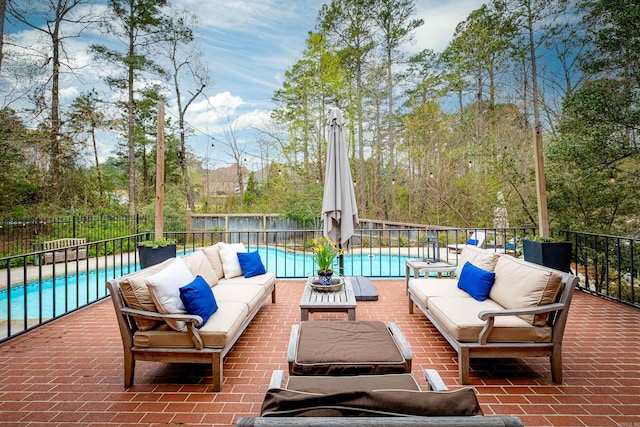 exterior space featuring a fenced in pool and outdoor lounge area