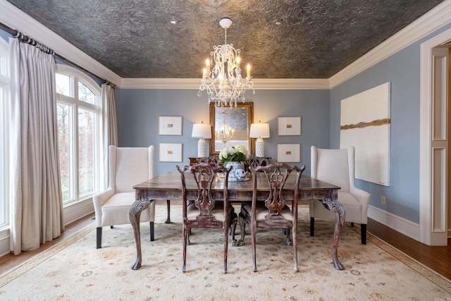 dining room with crown molding, light hardwood / wood-style flooring, and a notable chandelier