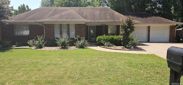 ranch-style house featuring a garage and a front lawn