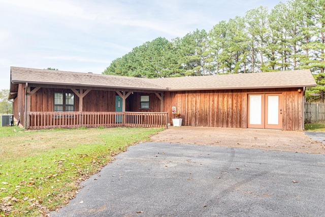 single story home with a front yard and a porch