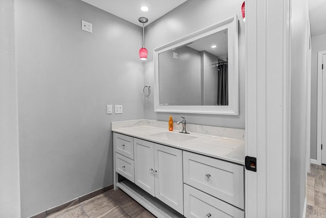 bathroom featuring hardwood / wood-style flooring and vanity