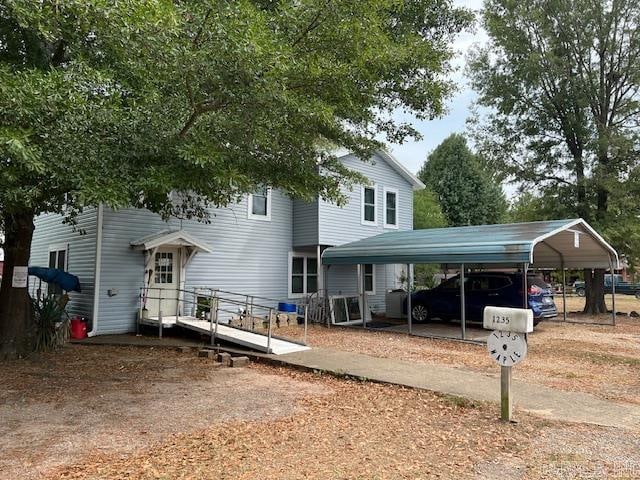 view of front facade with a carport