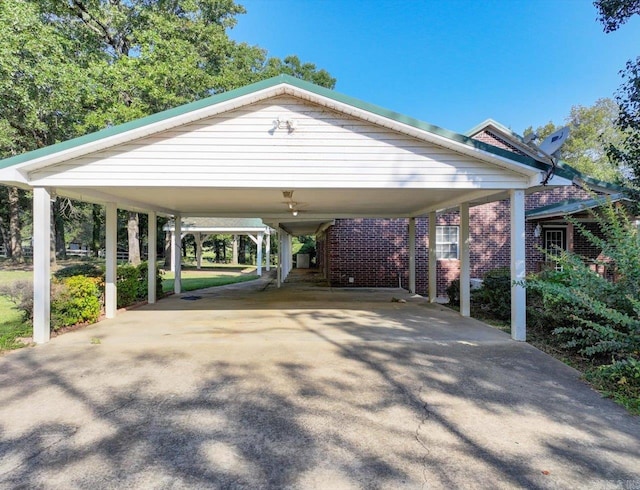 view of parking / parking lot with concrete driveway