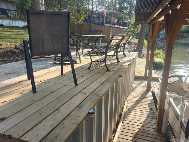 wooden terrace with a water view