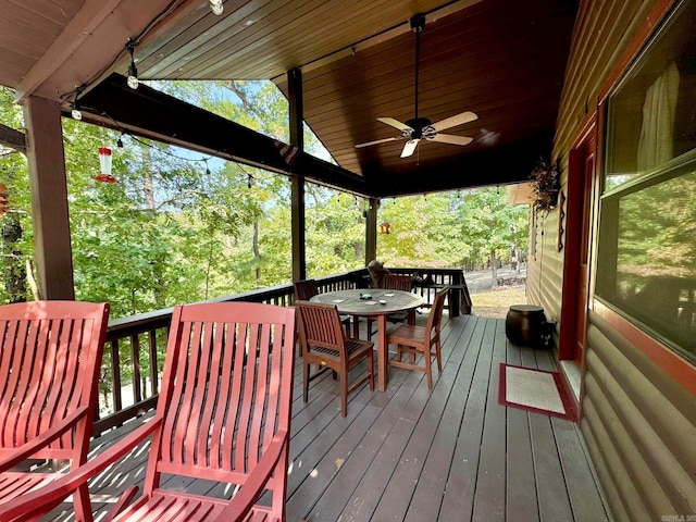 wooden deck featuring ceiling fan